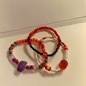 3 pack handmade glass and clay bead bracelets. handmade. stretchy.